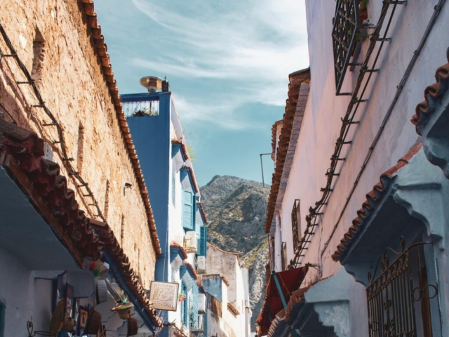 pexels-photo-3049883-3049883 Vibrant street scene in Chefchaouen, Morocco, showcasing iconic blue architecture under a clear sky.