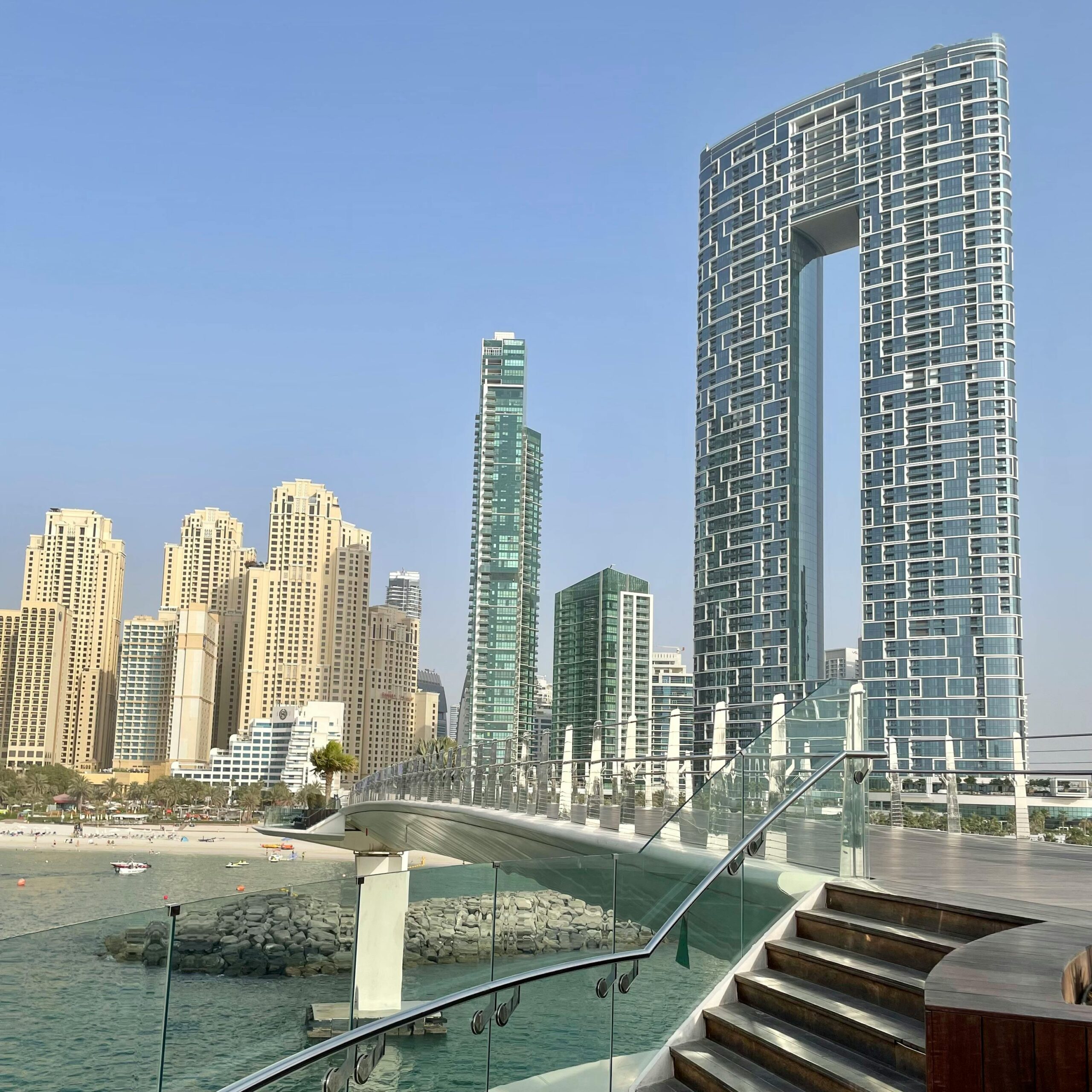 Stunning view of downtown Dubai skyscrapers with futuristic architecture and clear blue sky.